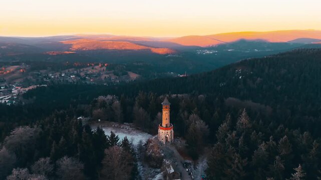 Explore Stepanka Lookout Tower in the Jizera Mountains during sunset. See how the light changes the landscape as winter and autumn blend together in Koronov.