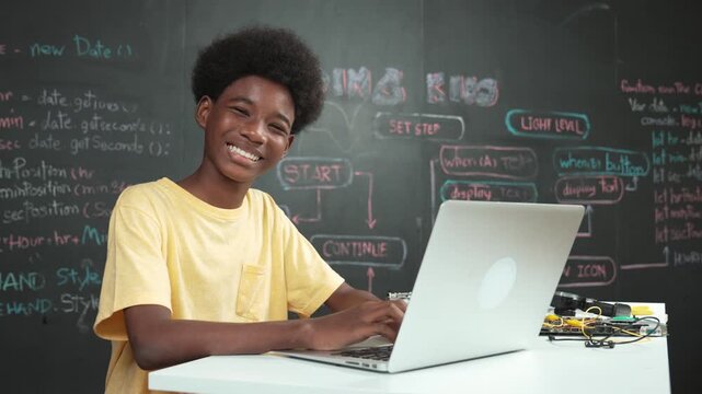Smart african student programming and coding innovative system while caucasian girl enter in metaverse or virtual world by using VR or head set at blackboard in STEM technology classroom. Edification