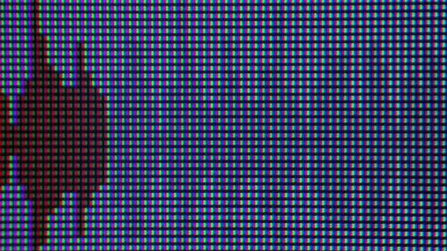 Extreme macro view of a mouse cursor clicking a play button icon on a pixelated LCD display with visible RGB subpixels. Video playback, streaming media, digital content, and user interface concept.
