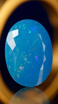 Macro close up slow motion, shiny glossy blue opal gemstone moving under warm lighting, 4k.