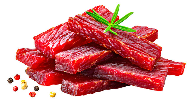 Pile of smoky red dried meat jerky strips seasoned with bold spices, isolated on white background