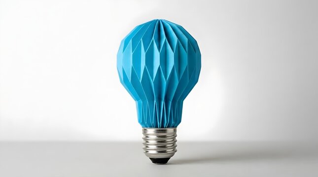 Blue papercraft lightbulb with origami folds representing calm logical thinking and intelligent technological solutions