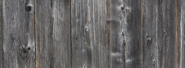 Fototapeta premium Dark wooden plank background with rustic horizontal grain for texture and design