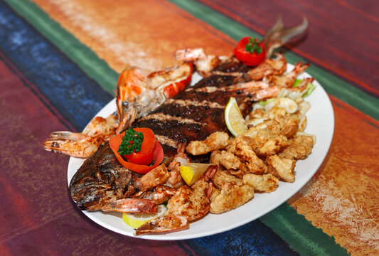 Mixed seafood platter with grilled whole fish fried calamari and prawns