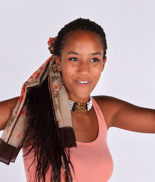 Expressive young african black woman posing with hand up in studio portrait