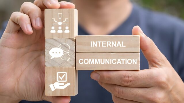 Business Professional Holding Wooden Blocks Representing Internal Communication Strategies and Effective Corporate Team Collaboration Icons