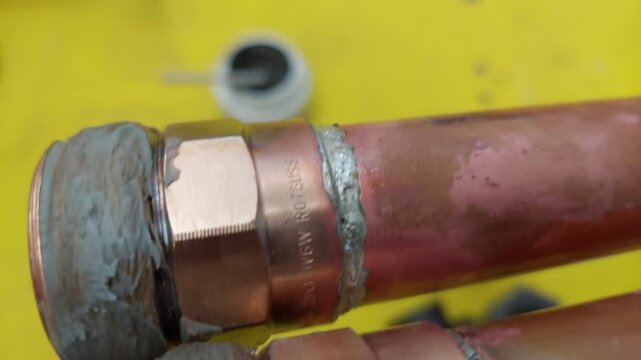 Soldered copper pipe joints with threaded brass fittings and thread sealant paste