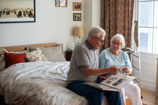 Elderly couple reminiscing together joyfully