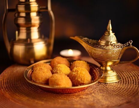 close up of sri lankan sweets and brass lamp for aluth avurudu festival heritage and culture