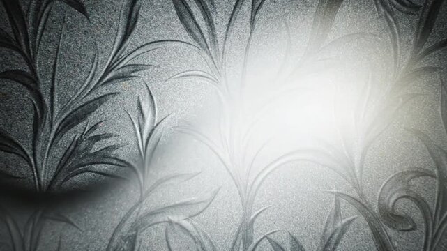 Elegant monochrome floral pattern with intricate leaf motifs and soft light, creating a sophisticated textured background for design projects
