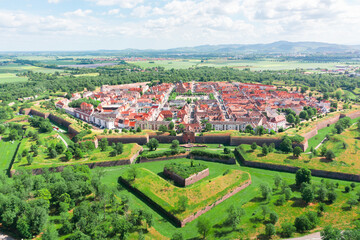 Naklejka premium Drone view of the historic fortified town of Neuf-Brisach in Alsace, France. The star-shaped fortifications designed by Vauban are visible from above