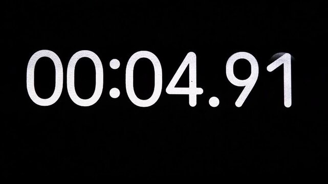 Digital stopwatch counts upward from zero to thirty seconds on a black screen, demonstrating precise time measurement, elapsed duration tracking and modern electronic timing technology