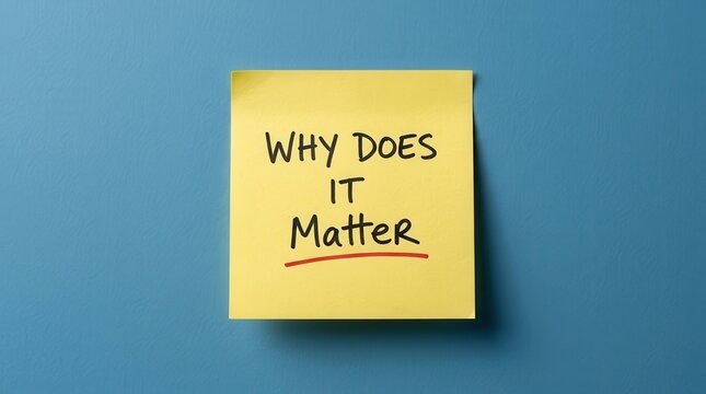 A yellow sticky note with the text WHY DOES IT Matter on a blue background for reflection and motivation.