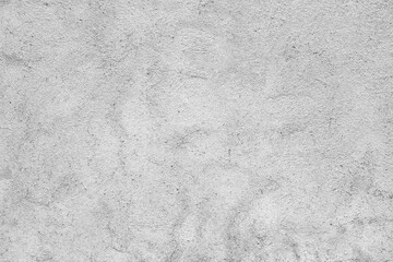 Obraz premium Light gray stucco wall texture with fine grain surface and subtle vertical patterns. Clean plaster background suitable for design and architectural use