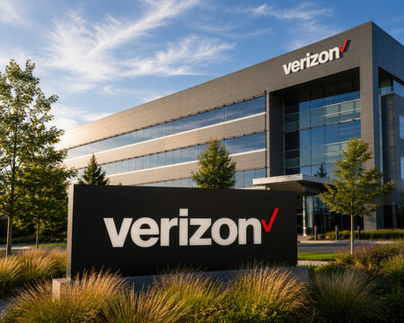 Verizon building exterior with corporate signage and landscaping under a blue sky office headquarters