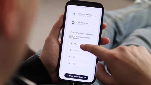 Close-up of a modern language learning app. User interacts with a clean UI, attempts a Spanish vocabulary challenge, and gets instant feedback. Ideal for software reviews, app demos, and modern