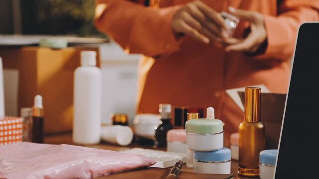 Two happy women Asian bloggers smiling and laughing while online streaming from mobile sell cosmetics makeup beauty products in living room, Concept teenagers or friends, business lifestyle at home.