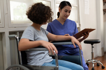 Fototapeta premium Healthcare interaction with wheelchair user.
