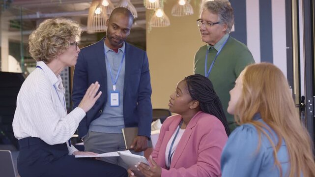 Mature businesswoman leading an annual report meeting