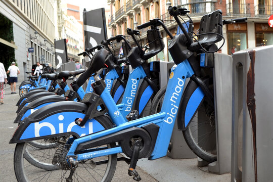 MADRID, SPAIN - JUNE, 4, 2026. Bicimad bike sharing station with row of blue bicycles in madrid for transport background and urban mobility banner design