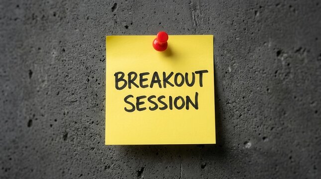 Yellow sticky note with breakout session handwriting for business training and teamwork group activity.