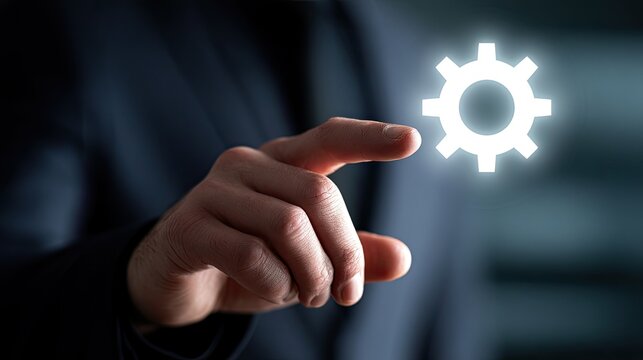 Digitally enhanced gear icon is touched by a finger, signifying control