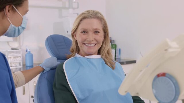 Happy mature woman smiling  at dentist