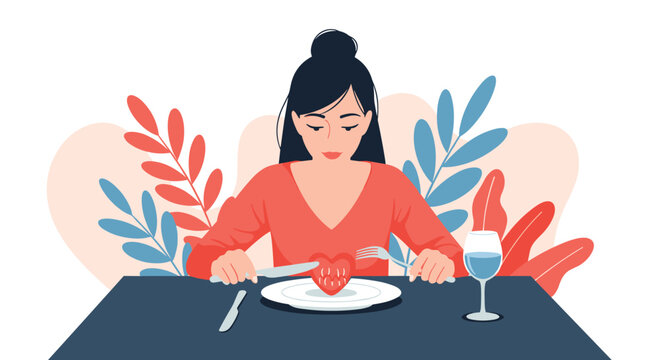 Melancholic young woman sitting at dining table cutting a red heart on her plate representing heartbreak or self love.