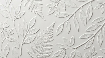 Fototapeta premium White embossed leaf relief texture background with a botanical pattern on a plaster wall panel. Elegant neutral masonry surface