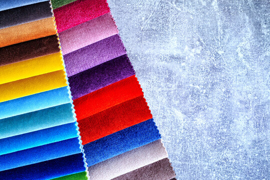 Catalogs of furniture fabrics textile sample for renovation.Velvet and textile fabric swatches in different shades and tones for furniture and home interior use.Furniture fabric collection