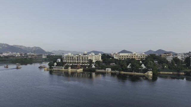 Drone View of The Leela Palace Udaipur on Lake Pichola Featuring Luxury Lakefront Hotel, Royal Architecture, and Scenic Rajasthan Heritage Landscape