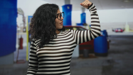 Woman with eyes closed and hand raised beside a red car at a petrol station on a street  contemplation. © Krakenimages.com