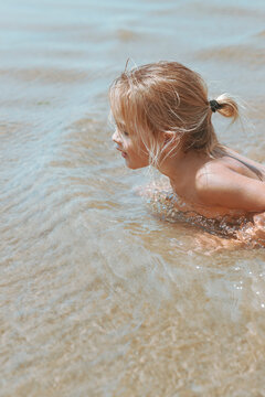 Little Child Playing In Seawater