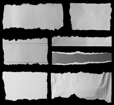 Torn papers on black