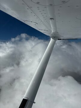 Small airplane over the clouds