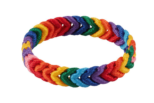 A vibrant rainbow colored braided bracelet made of woven nylon cord, isolated on a black background, featuring a circular loop pattern