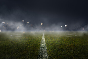 Obraz premium textured soccer game field with neon fog - center, midfield. Stadium Arena, smoke