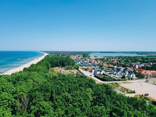 Fototapeta premium Baltic Sea, Aerial coastal town with beach and forest