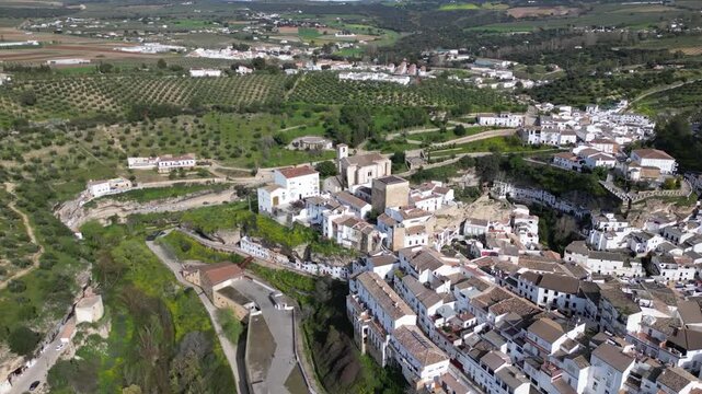 Aerial Drone Orbiting Main Church and Cave Houses of Setenil de las Bodegas, Andalusia, Spain