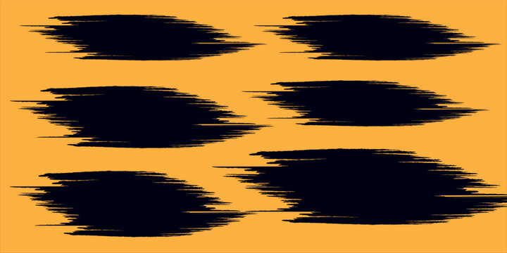 Abstract black grunge brush stroke collection isolated on orange background.