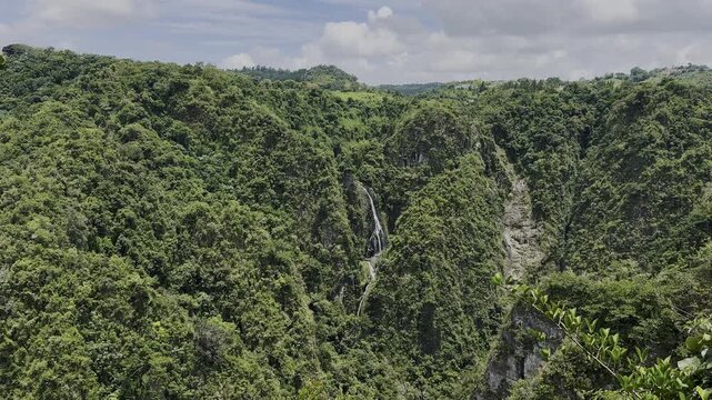 San Cristobal Canyon Waterfall in Barranquitas Puerto Rico With Lush Green Cliffs
