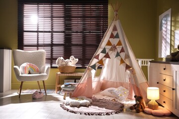 Beautiful wigwam, cushions and toys in child's room © New Africa