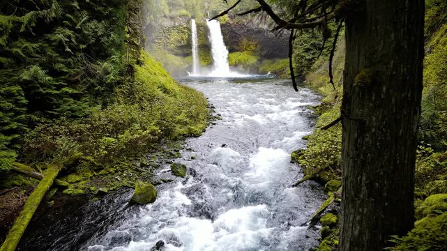 Aerial shot of the amazing Koosah Falls and lush moss covered forest on the McKenzie River in Oregon.
