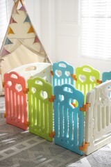 Beautiful playpen and wigwam in child's room, closeup © New Africa