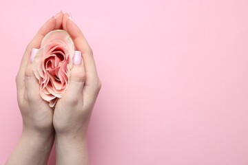 Naklejka premium Gynecology. Woman with beautiful rose on pink background, top view. Space for text