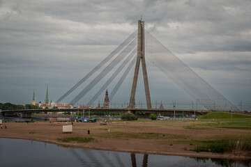 Obraz premium Cable Stayed Bridge in Riga Latvia Under Dramatic Cloudy Sky