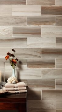 A tranquil spa setting features stone tiles, wood, floral accents, and a soft candle flame. Earth tones and neutral creams evoke refined relaxation and calm.