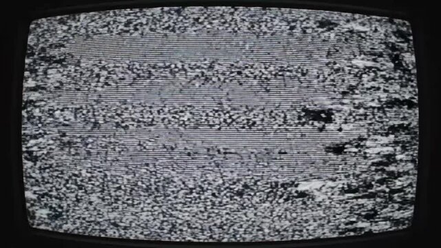 Abstract display of broken television signal showing static and noise on screen in indoor environment