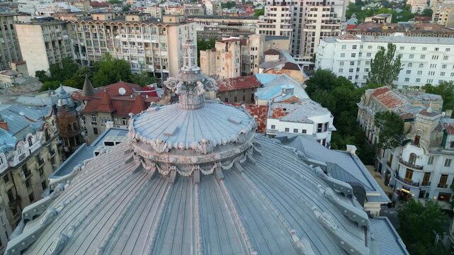 Aerial drone perspective of the Romanian Athenaeum building during daytime, historical monument and tourist attraction in Bucharest downtown, Romania.