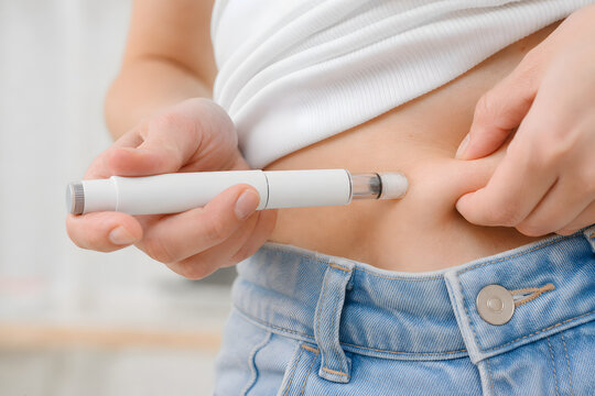 Close up abdominal self injection with pen